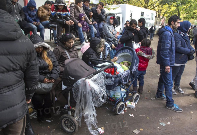 Refugees from Syria waiting to be registered at the Central Reception Centre for Asylum Seekers at the Berlin State Office for Health and Social Affairs, 09.10.2015