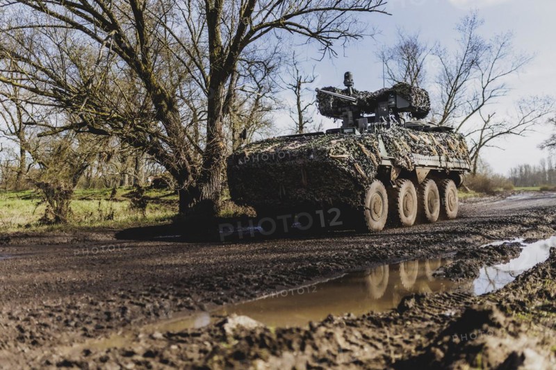 A Pandur II tank drives through a forest as part of the military exercise 'Wettiner Schwert' with German and Czech soldiers near Tangermünde, 26 March 2024. 'Wettiner Schwert' is part of the NATO Quadriga exercise