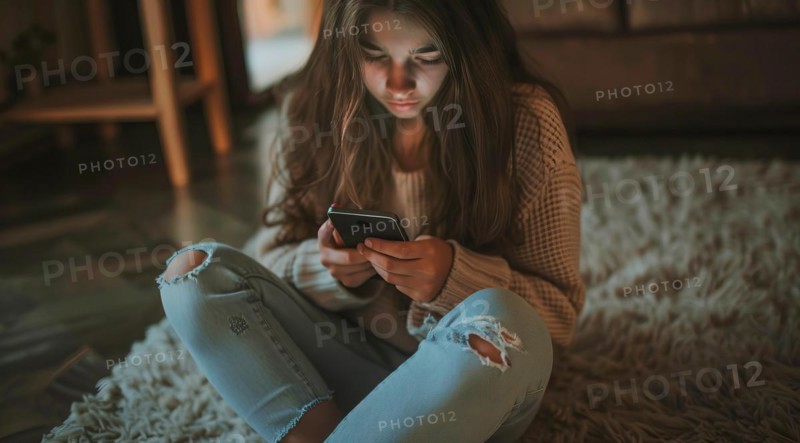 Teenager browsing internet on mobile device and playing with smartphone apps, AI generated