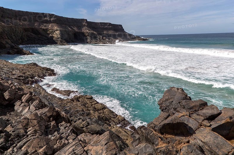 Waves breaking in a small bay near Los Molinos, west coast of Fuerteventura, Canary Islands, Spain, Europe