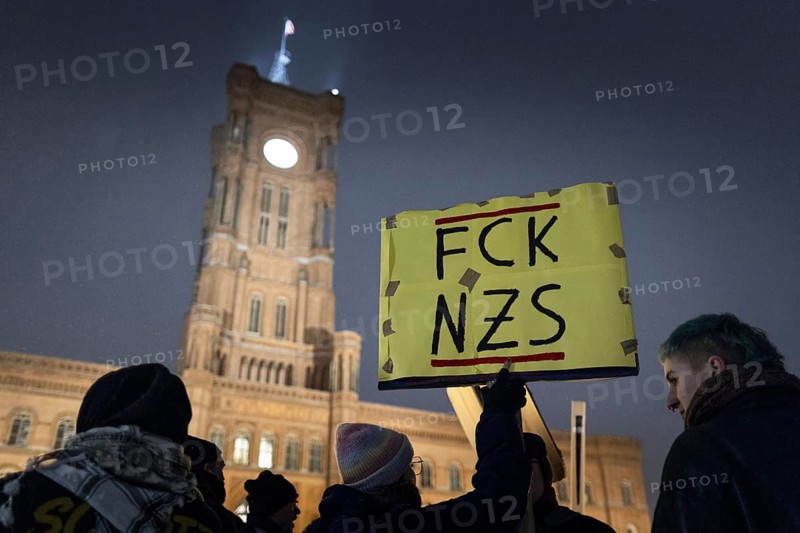 Pictures taken during the demonstration Auf die Strasse! Against Nazi deportation plans of the AfD in front of the Rotes Rathaus in Berlin, 17.01.2024. A sign with the inscription FCK NZS