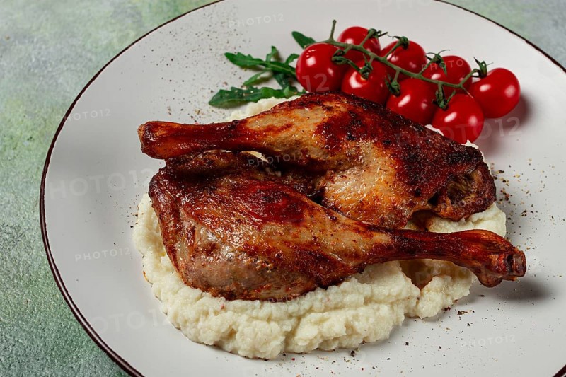 Fried duck shank, cauliflower puree, cherry tomatoes, homemade, no people