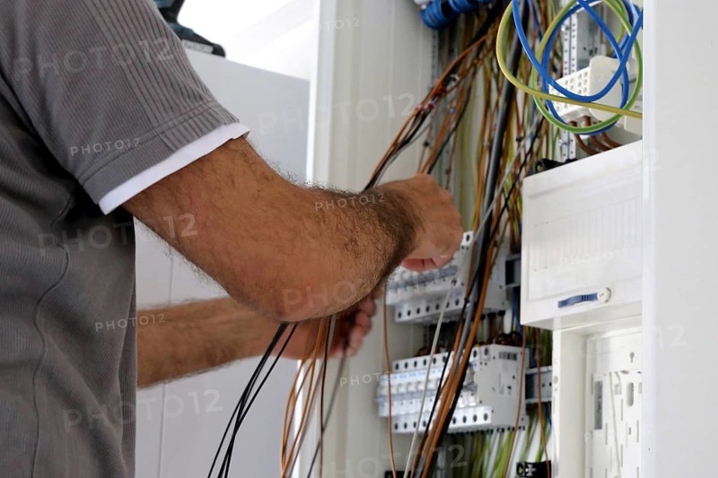 Professional electrical installation on a building shell