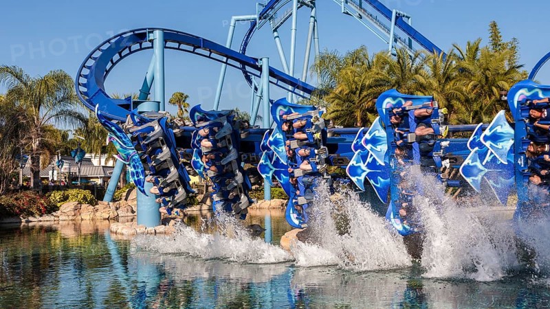 Manta roller coaster behind water splashes in lagoon at Sea World in Orlando, Florida, USA, North America