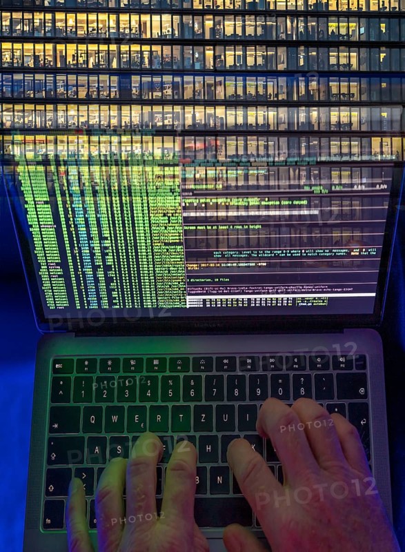 Symbolic image hacker, cyber attack on public buildings, administrations, institutions, town hall, authorities, digital blackmail, data theft, online criminal offences, cyber extortion, ransomware