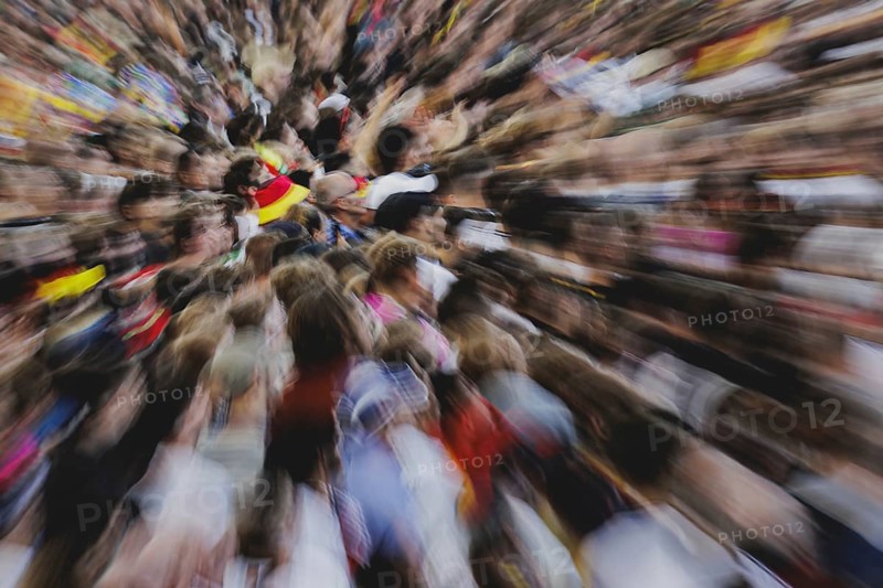 Fans react during the European Championship preliminary round match between Germany and Hungary on the fan mile in front of the Brandenburg Tor in Berlin, 19 June 2024