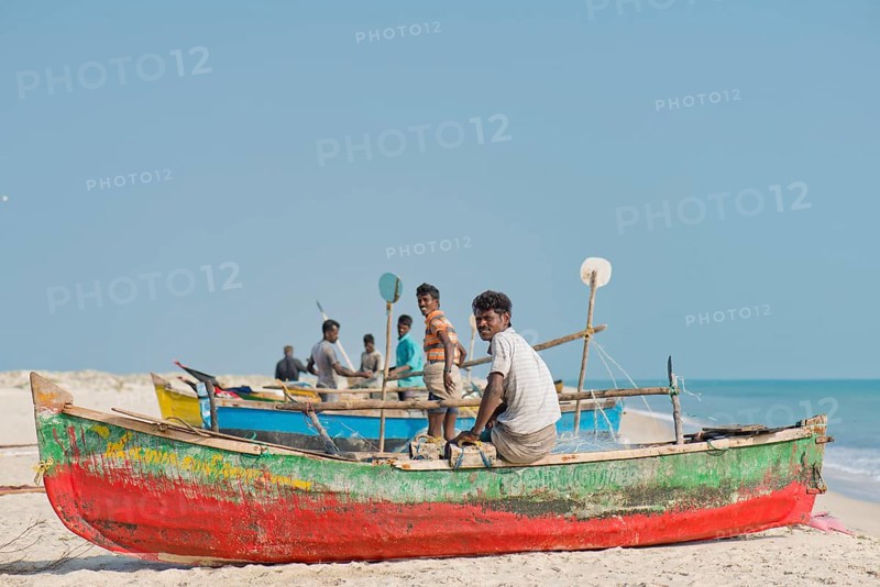 Fishermen, fishing boats, beach at Adam's Bridge, Rameswaram Island, near Rameshwaram or Ramesvaram, Tamil Nadu, South India