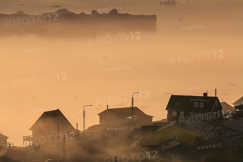 Inuit settlement in front of icebergs in the fog, midnight sun, summer, Ilulissat, Ilulissat Icefjord, Disko Bay, West Greenland, Greenland, North America