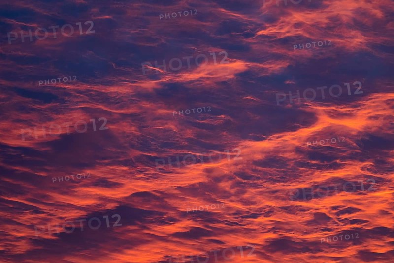 Reddish orange cloud structures, dawn