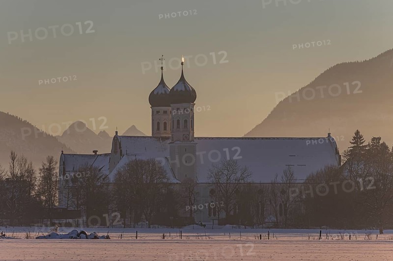 Monastery and basilica in the evening light in front of mountains, snow, winter, Benediktbeuern Monastery, Alpine foothills, Upper Bavaria, Bavaria, Germany, Europe
