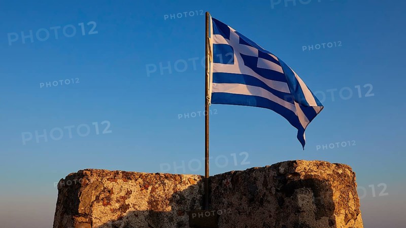Evening light, Corner tower, Greek national flag, Frangokastello, Venetian fortress, Zwingburg, Sfakia, West Crete, South coast, Island of Crete, Greece, Europe