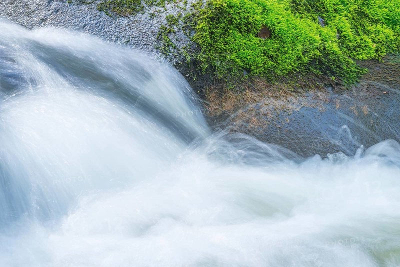 Fast flowing water flows over moss-covered stones, boulders, in a small river, rapids, riverbed with boulders in spring (May), rocks with moss, wiping effect, long exposure, motion blur, soft focus, river Bode, Bode Valley, Harz district, Eastern Harz, Harz, Saxony-Anhalt, Germany, Europe