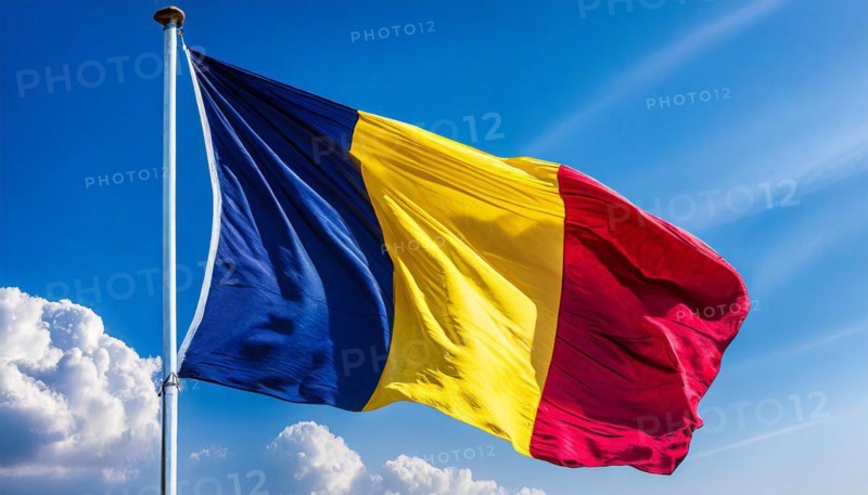 Flags, the national flag of Chad flutters in the wind