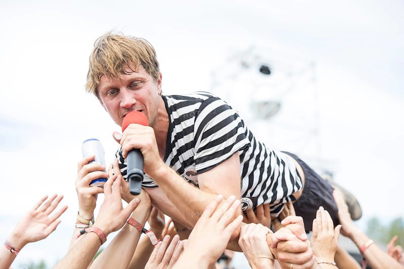 Beat Schmutz, singer of the band Schmutzki crowdsurfing on the beach in front of the Becks Beach Stage at the Highfield Festival on Saturday, Störmthaler See, 17/08/2024