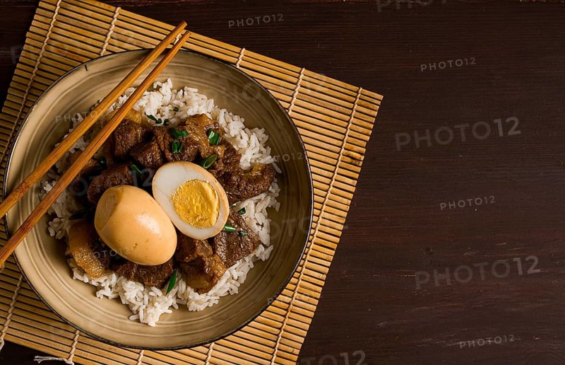 Stewed eggs, with pork belly, and rice, chinese food, homemade, selective focus, rustic, no people