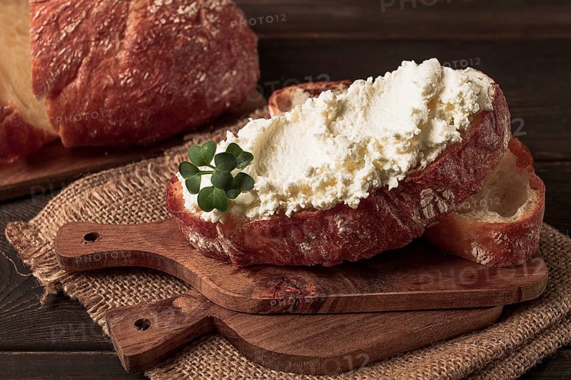 Sandwich, with cream cheese, homemade, on a cutting board, rustic style, no people, selective focus, breakfast