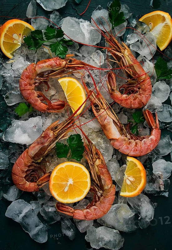 Tiger prawns, boiled and frozen, on ice, top view, close-up, no people
