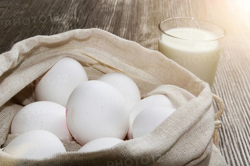 Symbolic image of baking ingredients: Eggs in a cloth bag
