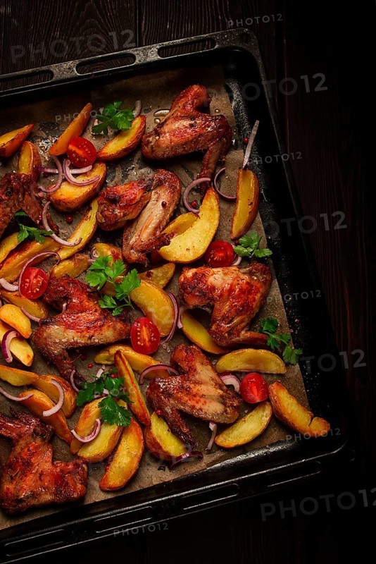 Fried chicken wings, with potatoes, and spices, homemade, fast food, no people