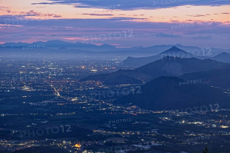 View of the densely populated Neapolitan region and the mountains near Caserta at dusk. San Felice a Cancello, Caserta, Campania, Italy, Southern Europe, Europe