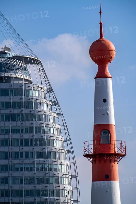 Skyline of Bremerhaven, Atlantic Sail City Hotel skyscraper, front light Bremerhaven, a red and white striped lighthouse, at Willy-Brandt-Platz, at the Seebäderkaje Bremen, Germany, Europe