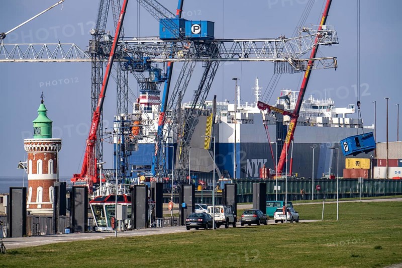 Car carrier ship, GOLIATH LEADER, at the general cargo terminal, Columbuskaje, harbour cranes, historic Pingelturm, in the seaport of Bremerhaven, Bremen, Germany, Europe
