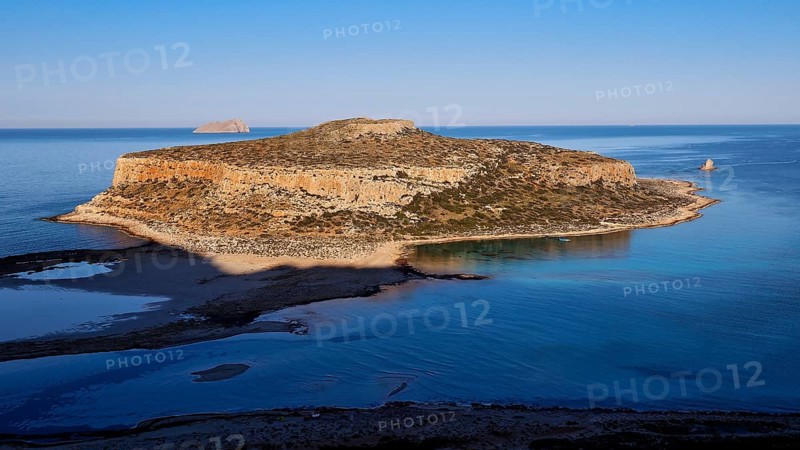 Island surrounded by calm sea with rocky cliffs, under clear day skies, natural beauty, Gramvoussa, Gramvoussa Peninsula, Pirate Bay, Balos, lagoon, north-west Crete, Crete, Greek Islands, Greece, Europe