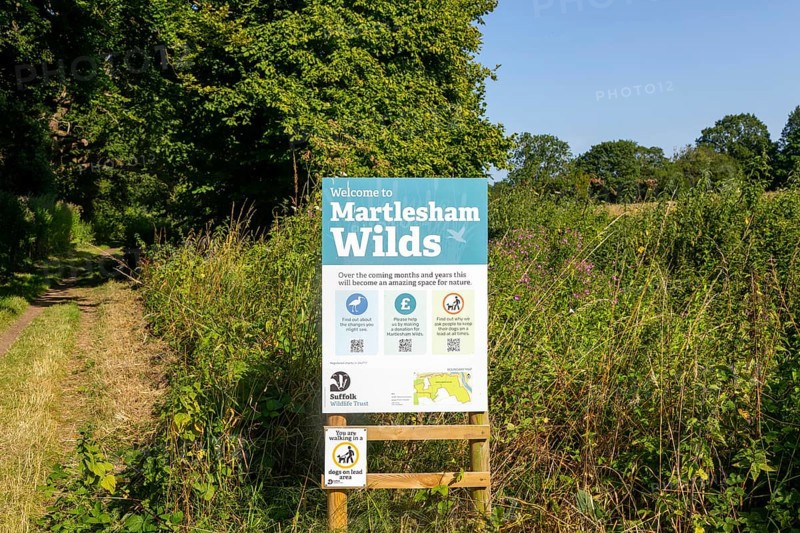 Sign for Martlesham Wilds, Suffolk Wildlife Trust farmland rewilding project, near Woodbridge, Suffolk, England, UK