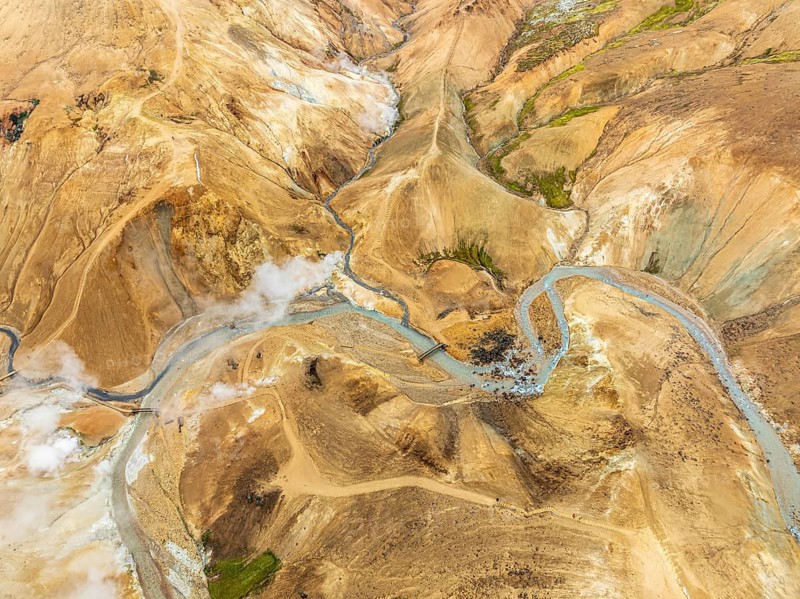 Steaming hot springs and colourful rhyolite mountains, aerial view, Hveradalir geothermal area, Kerlingarfjöll, Icelandic highlands, Iceland, Europe