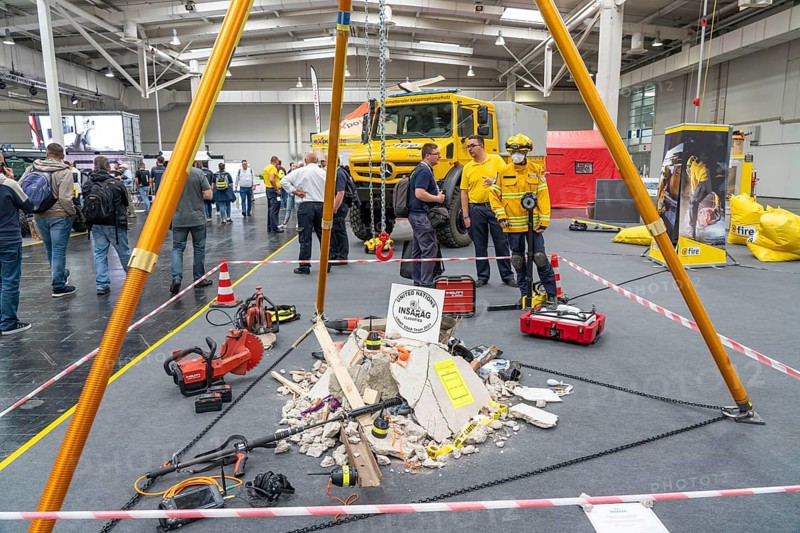 Information stand of the aid organisation @Fire, which helps worldwide in the event of disasters, earthquakes, forest fires, the Interschutz 2022 trade fair in Hanover, the world's largest trade fair for fire, rescue and disaster control technology, equipment, over 1300 exhibitors from 50 countries, disaster control