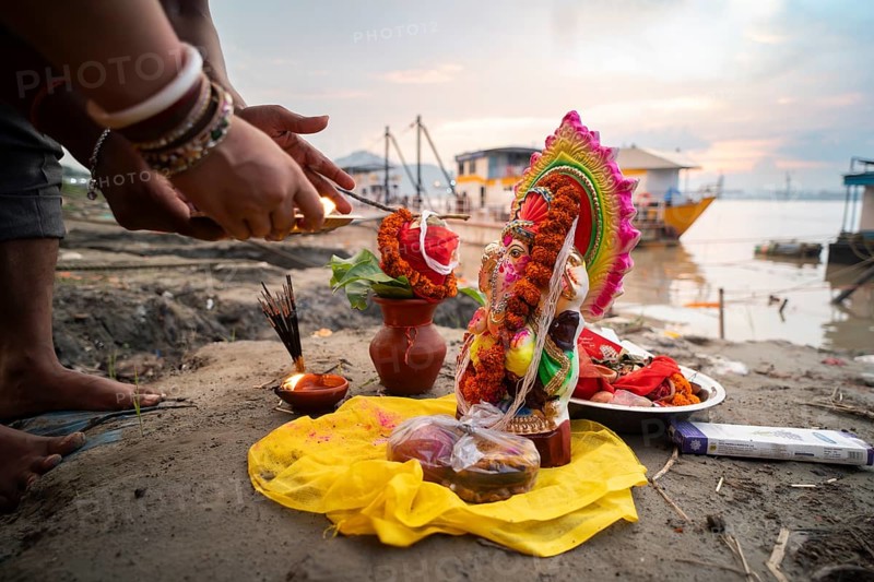 Devotees offer prayers to the Ganesha idol before immerse in the Brahmaputra river, during Ganesh Chaturthi festival, in Guwahati, Assam, India on Saturday, 9 Sept 2024