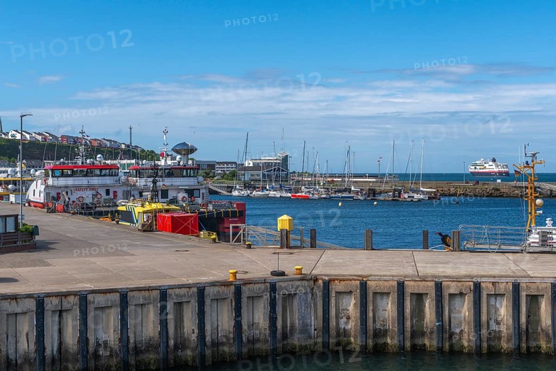 Inland harbour with sailing yachts and offshore supply ships, pier, passenger ship MS Maud of Hurtigruten AS at sea, offshore island of Helgoland, North Sea, Pinneberg district, Helgoland, Schleswig-Holstein, Germany, Europe