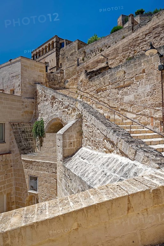 Paths and corridors in the tuff of the Sassi Barisano in the cave town of Matera. The cave settlements, Sassi, are a UNESCO World Heritage Site. Matera, Basilicata, Southern Italy, Southern Europe