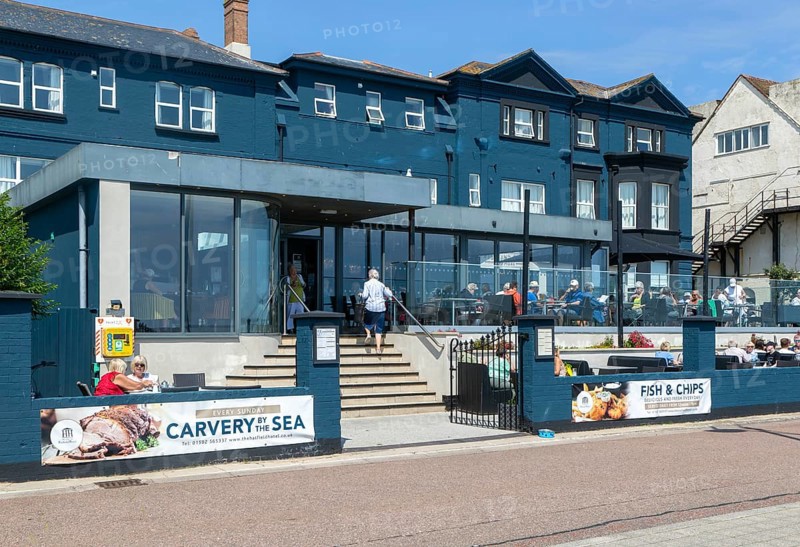 People sitting outside cafe restaurant, Best Western Hatfield hotel, The Esplanade, Lowestoft, Suffolk, England, UK