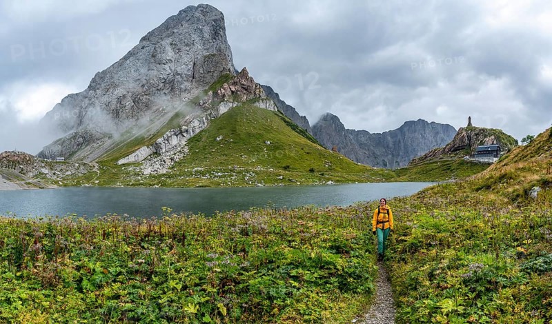 Wolayersee and Wolayerseehütte, hiker on the Carnic High Trail, Carnic Alps, Carnic Alps main ridge, Austria, Europe