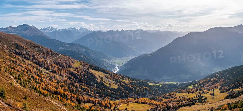 View of the mountain panorama and the Upper Inn Valley in the morning light, Krahberg on the Venet in autumn with yellow larches, Ötztal Alps, Tyrol, Austria, Europe
