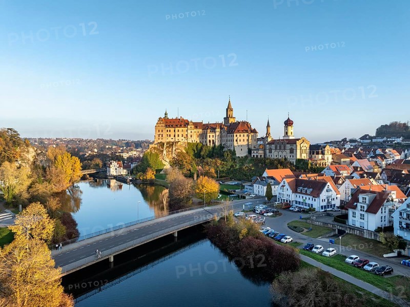 Aerial view of the town of Sigmaringen with the Hohenzollern Castle, a sight and tourist attraction above the old town and the Danube with autumnal vegetation, Danube valley, district of Sigmaringen, Baden-Württemberg, Germany, Europe
