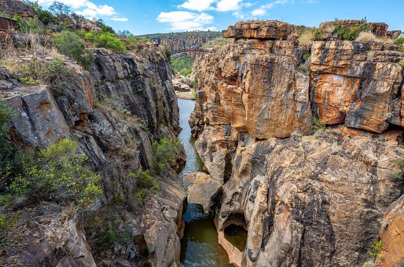 Bridge over a canyon with steep orange-coloured cliffs and the Blyde River, Bourke's Luck Potholes, Panorama Route, Mpumalanga, South Africa, Africa