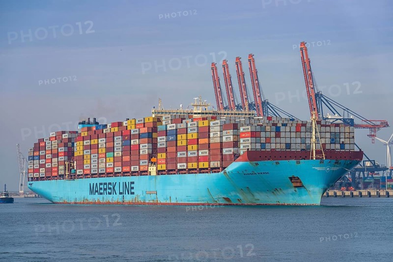 Harbour tugs bring the container freighter Madison Maersk from its berth at the RWG Container Terminal, through the Yangtzekanaal, out to sea, Maasvlakte 2 harbour, Rotterdam, Netherlands