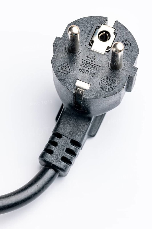 Close-up of a Schuko plug on a white background
