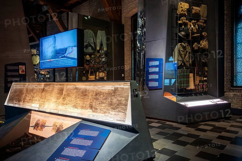 WWI soldier's equipment on display and battlefield map in the In Flanders Fields Museum about World War One at Ypres, Ieper, West Flanders, Belgium, Europe