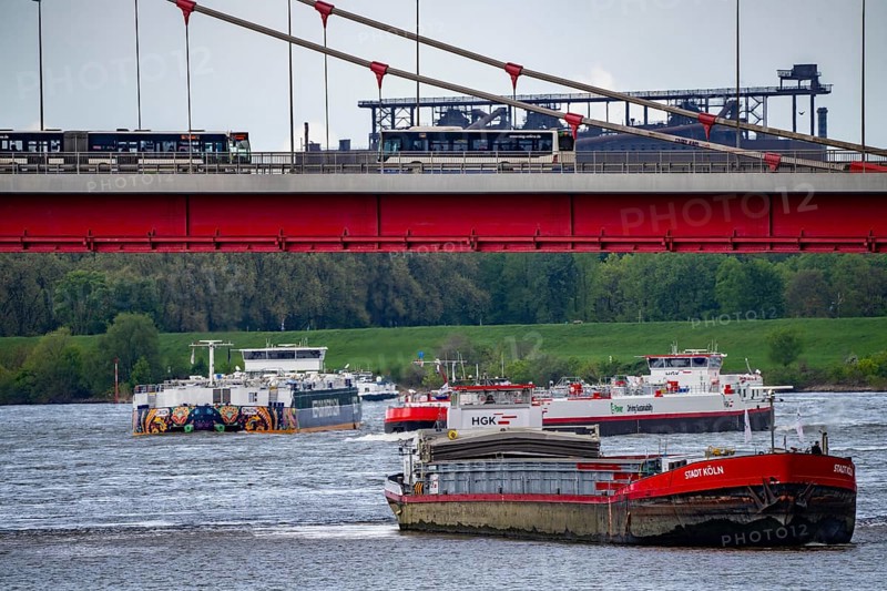 Cargo ships on the Rhine near Duisburg, near Ruhrort harbour, Friedrich Ebert Bridge, behind Thyssenkrupp Steel steelworks, Oxygen steelworks 2, North Rhine-Westphalia, Germany, Europe