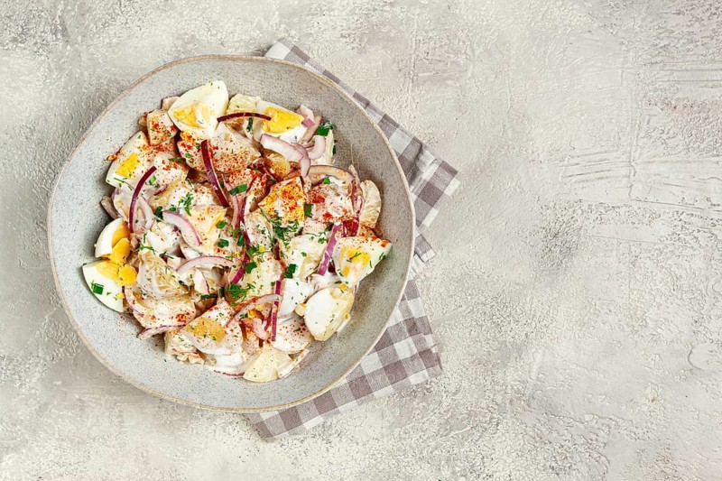 Potato and egg salad, red onion, with mayonnaise, homemade, no people