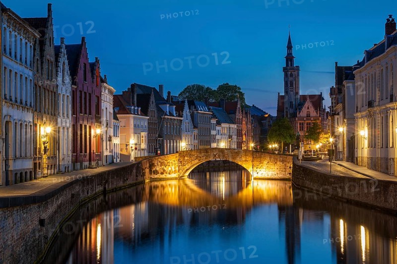 European medieval night city view background, Bruges (Brugge) canal in the evening, Belgium, Europe
