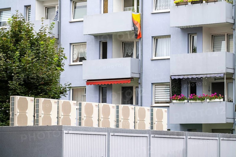 Heat pumps in a residential area, multi-family houses are supplied with heating, cooling and domestic hot water via these devices, installed on garage roofs, modernisation of the flats, Duisburg, North Rhine-Westphalia, Germany, Europe