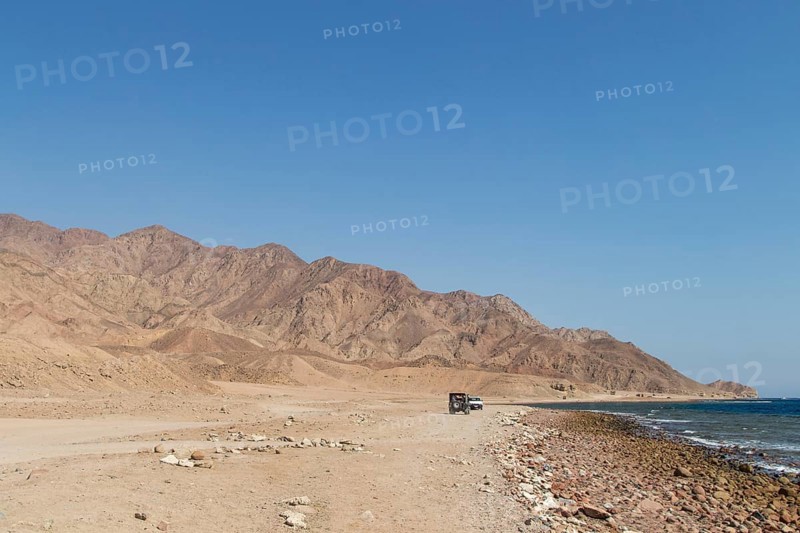 The coastline of the Red Sea and the mountains in the background. Egypt, the Sinai Peninsula, Dahab