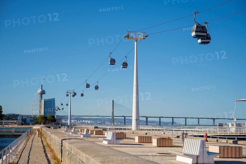 Telecabine Cable car in Lisbon in Parque des Nacoes Nations Park with Vasco da Gama bridge. Lisbon, Portugal, Europe