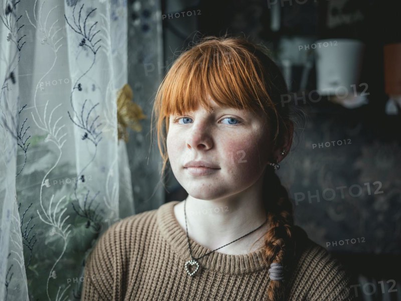 Bogdana in her family home in Voloska Balakliia. The village is close to the front line, artillery fire can be heard every day, Voloska Balakliia, Kharkiv Oblast, Ukraine, Europe