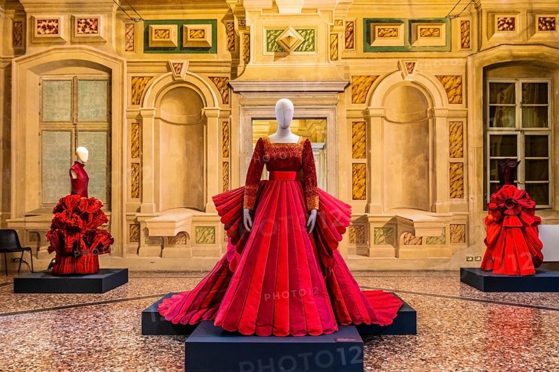 Red silk Mikado wedding dress in various shades of red with embroidered bodice, 2009, exhibition of magnificent evening dress creations by fashion designer Roberto Capucci, 17th century Villa Manin, residence of Ludovico Manin, Codroipo, Friuli, Italy, Codroipo, Friuli, Italy, Europe