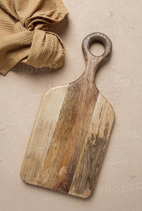 Cutting board, wooden, rectangular shape, with handle, with kitchen towel, top view, no people